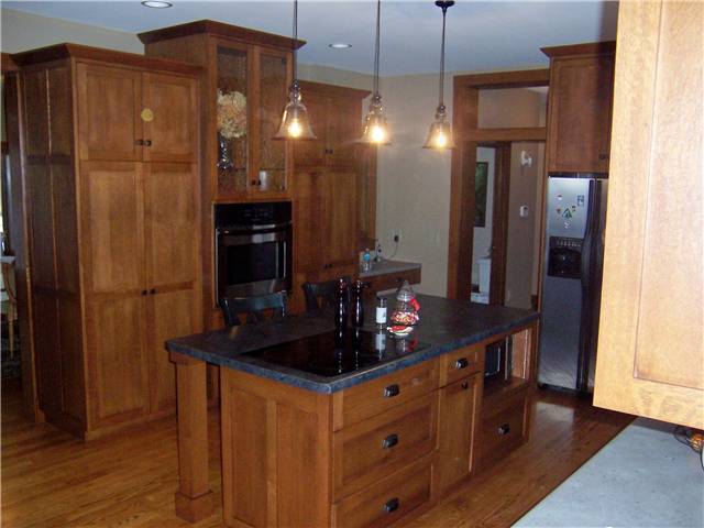 Quartersawn white oak cabinets - Flat panel doors, drawer fronts, and end panels - Full overlay style - Laminate countertops